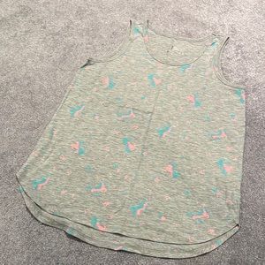 Justice brand tank top with unicorns.  60% cotton and 40% polyester.